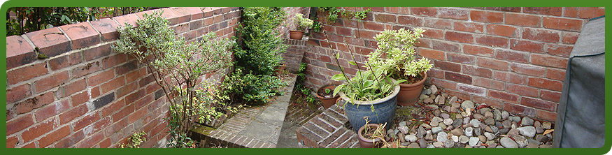 Rebuilt boundary wall in reclaimed imperial brick, Sheffield