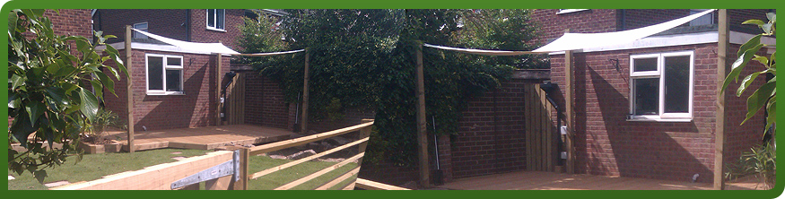 Canvas shade sail over a timber deck seating area, Rotherham