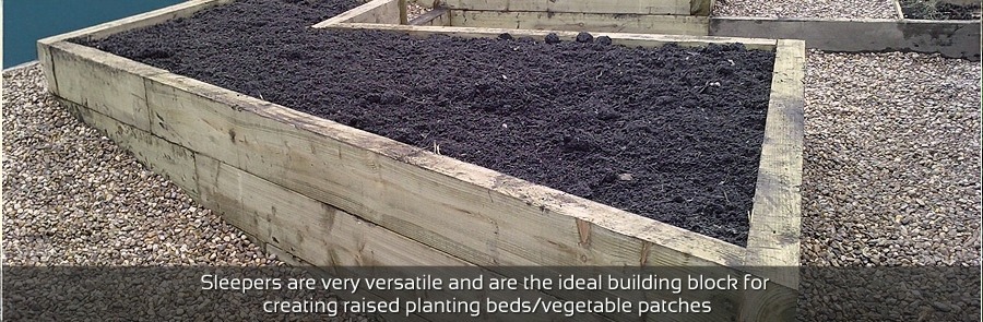 Railway sleeper planting beds with retainers
